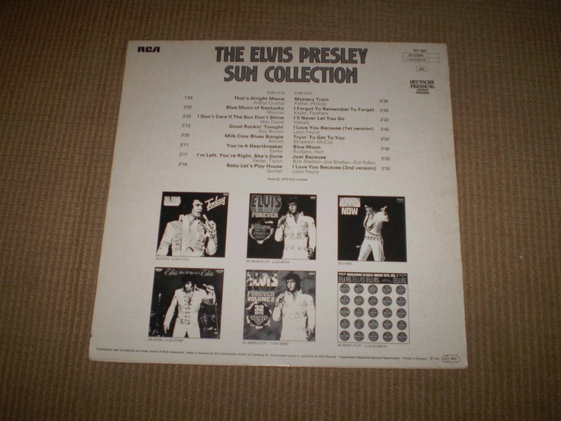 May include: A white record album cover with black text that reads "The Elvis Presley Sun Collection". The cover features a collage of album covers with Elvis Presley on each. The album covers are titled "Elvis Presley", "Elvis Forever", "Elvis Now", "Elvis Elvis Elvis", and "Elvis".