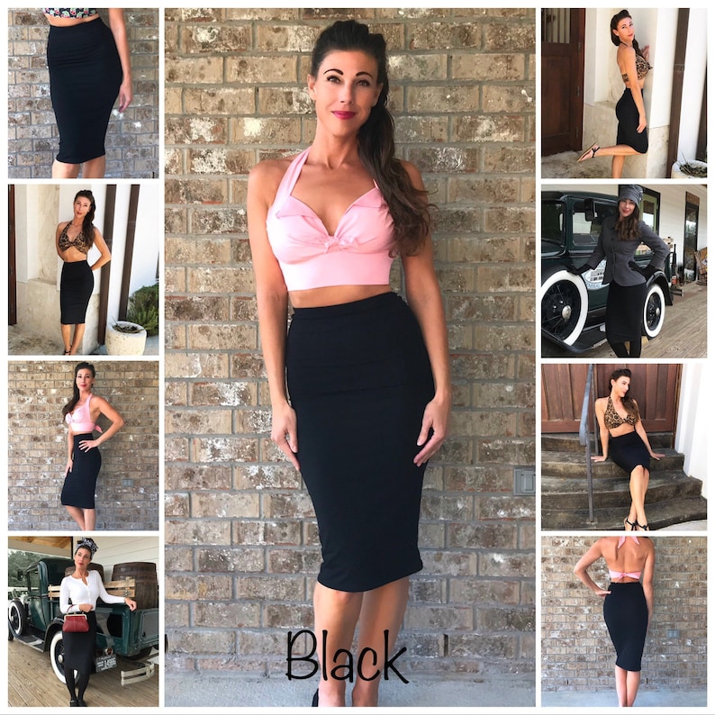 May include: A woman wearing a pink halter top and a black pencil skirt. The skirt is knee-length and has a high waist. The woman is standing in front of a brick wall. The text "Black" is written on the bottom of the image.