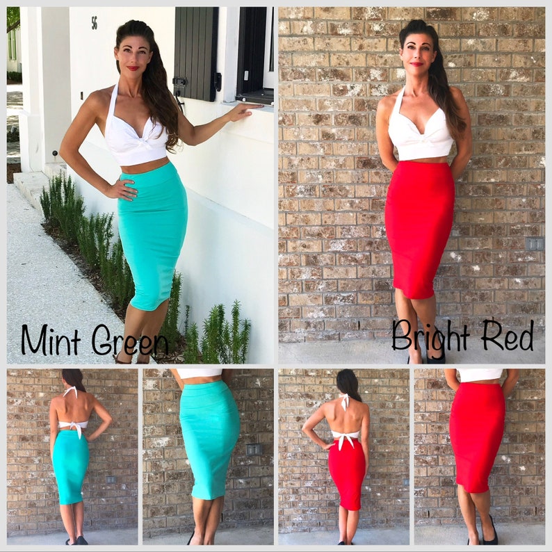 May include: Two women are wearing the same white halter top and a skirt. The skirt on the left is mint green and the skirt on the right is bright red. Both skirts are knee-length and fitted.