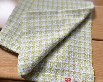 Extra large handwoven linen and cotton hand towel. Green and white with pinwheel pattern.