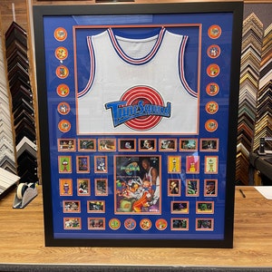 Michael Jordan Space Jam Tune Squad Jersey with collectible items framed