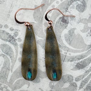 a pair of fishing hooks sitting on top of a table