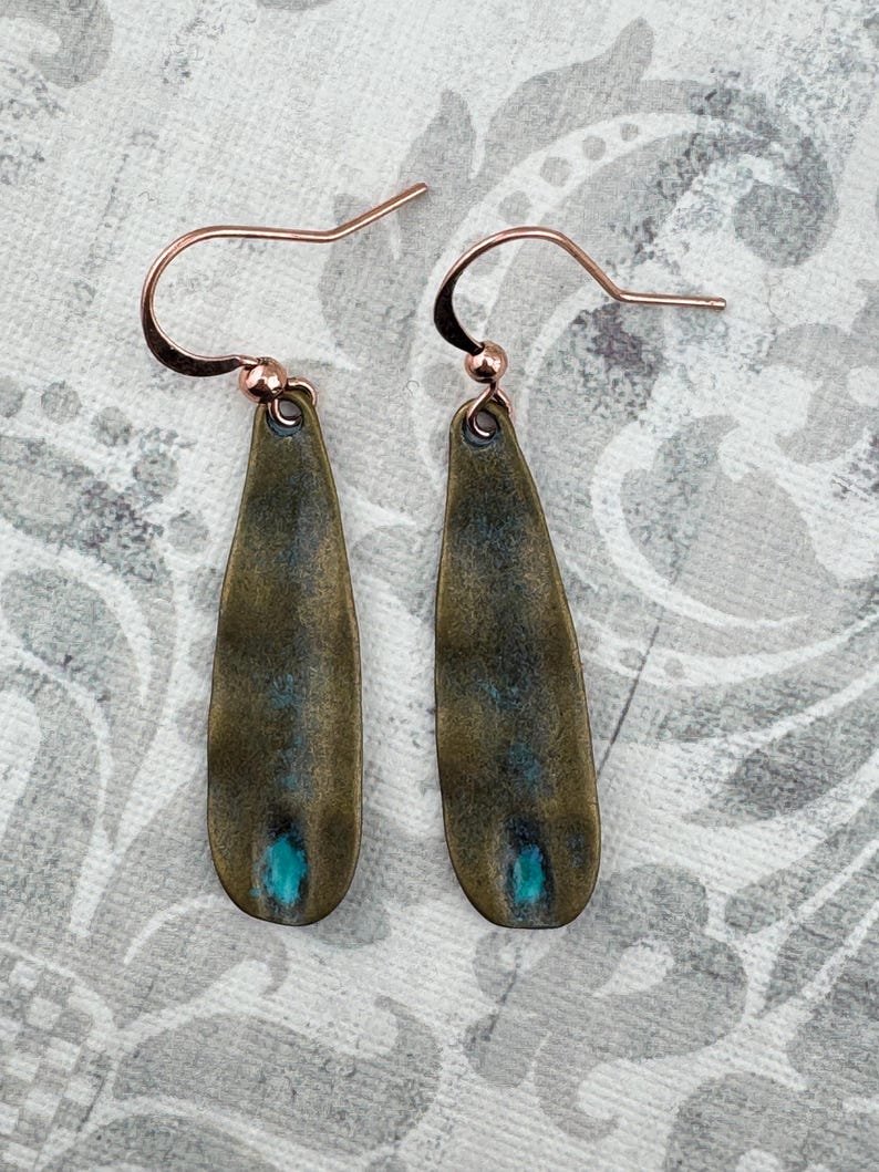 a pair of fishing hooks sitting on top of a table