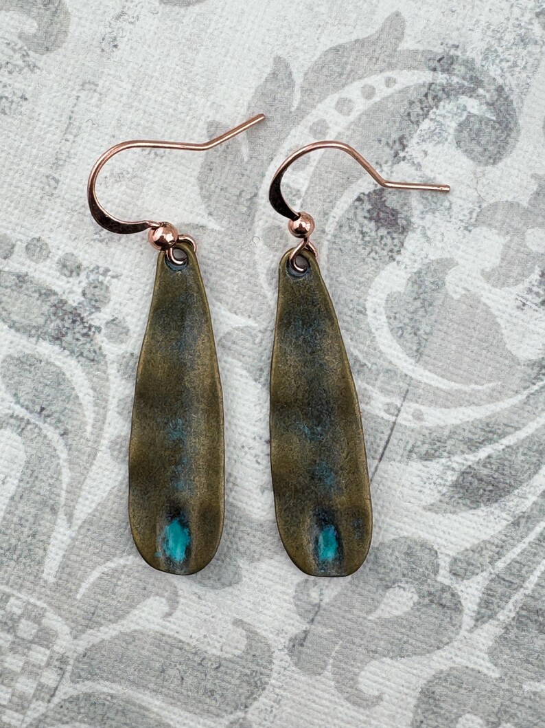 a pair of fishing hooks sitting on top of a table