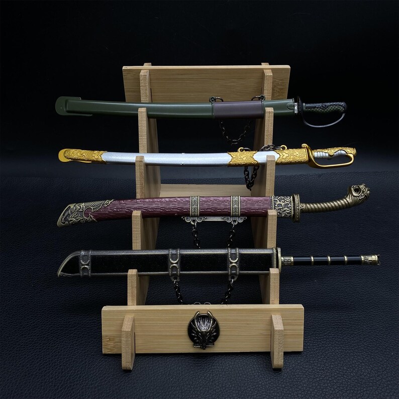 May include: Four decorative swords displayed on a wooden stand. The swords have various handle and sheath designs, including gold, brown, and black. The stand has a wolf head emblem at the base and a tiered design to hold the swords.
