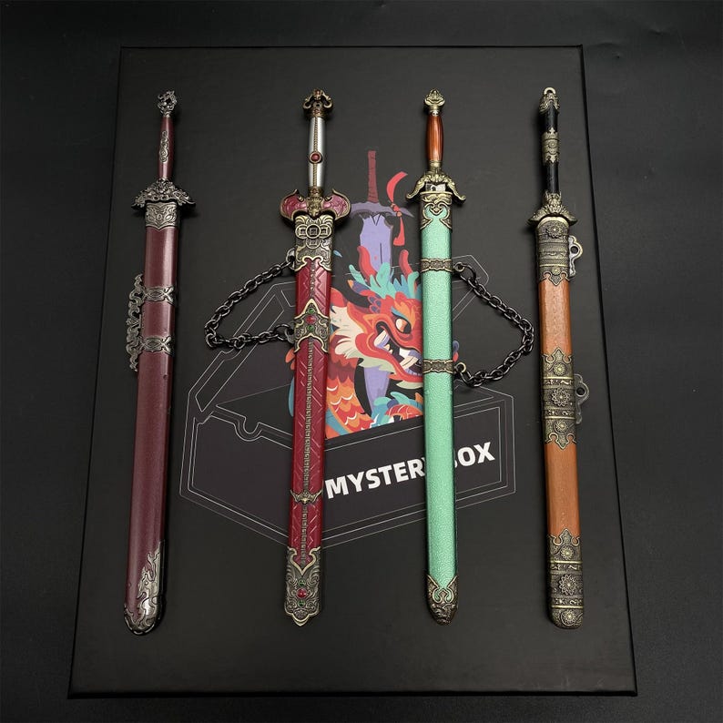 May include: Four decorative swords with detailed handles and sheaths in red, green, and brown. The swords are presented on a black surface, with a box featuring a dragon design and the text "MYSTERY BOX".