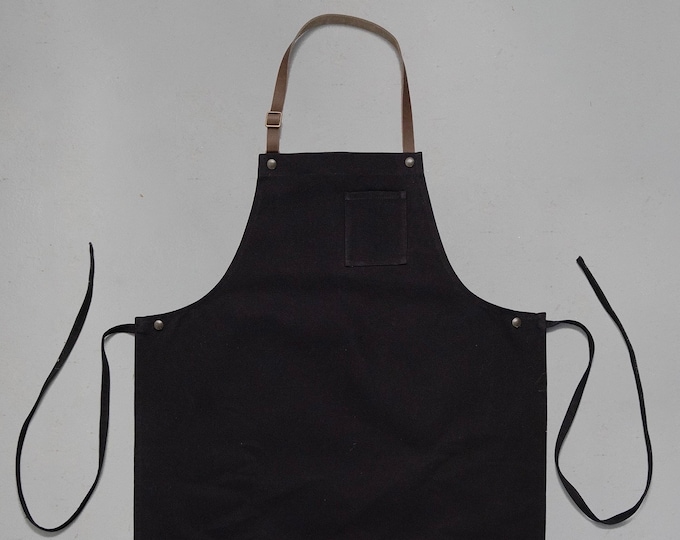 Fabric “chef” apron and leather neck strap