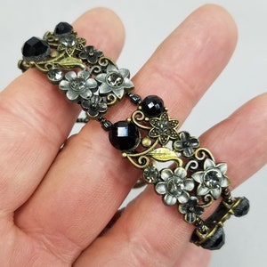 Antique gold and silver toned metal and black glass Bracelet 82
