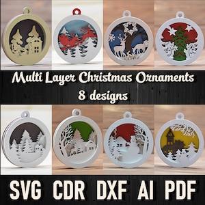 May include: Eight laser-cut Christmas ornament designs featuring a variety of winter scenes, including a house with trees, Santa in a sleigh, a deer in a snowy forest, a Christmas tree, a winter village, a snowman, and a house with a clock tower. The ornaments are multi-layered and ready to be assembled. The text "Multi Layer Christmas Ornaments 8 designs" is displayed above the ornaments. The text "LASER READY FILES" is displayed on the left side of the image. The text "INSTANT DOWNLOAD" is displayed on the right side of the image. The text "SVG CDR DXF AI PDF" is displayed at the bottom of the image.