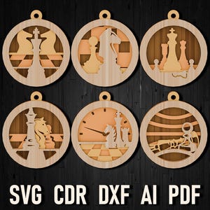 May include: Six wooden ornaments with laser cut designs of chess pieces. The ornaments are round and have a light brown color. The chess pieces are in various positions on a chessboard.