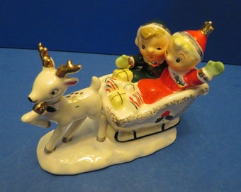 Vintage Napco Japan Boy and Girl Riding in Present Laden Sleigh Pulled by White Reindeer with Gold Antlers Wearing Gold Bell - Wonderful!