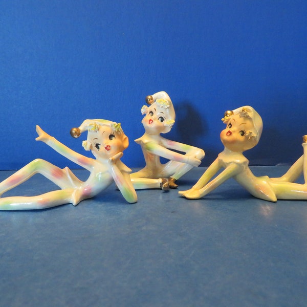 Lefton Irridescent Blonde Pixie Pair - Set of 3- One Laying Down w Her Feet in the Air, One Siting w Her Hands on Knee & One w Hand Raised