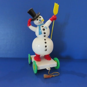 Miller Electric "Frosty the Snowman" on Wheeled Base Wearing Top Hat, Jaunty Scarf and Snowflake on Lapel- Has Pipe, Pull String, Shovel