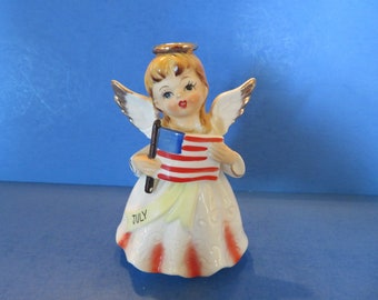 Nippon July Birthday Angel Wears Red and White Dress w Dimensional Details - Yellow Sash - Holds American Flag in Her Hands - Excellent!