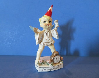 Lefton January Happy New Year Boy Angel Wearing Cone Party Hat and Drinking Adult Beverage Clock Ticks Away the Old Year!