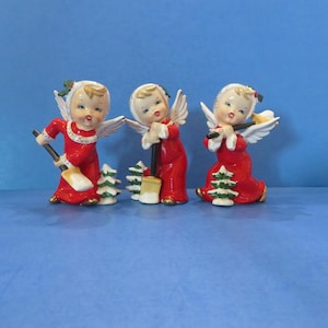 Fine A Quality Christmas Angels - Each Shoveling Snow on Christmas Morning - Holly Trimmed Hats - Snow Covered Trees - Rare Set of 3
