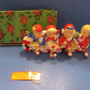Relco Candy Cane Kids Riding on Candy Cane Sleigh - Each Kid Holds Candy Cane - Serves as Stocking Hook! Near Mint - Original Box w Hang Tag