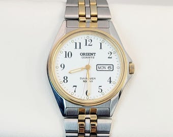 Vintage Orient Swimmer 100 M Quartz-klocka med tvåfärgad dagsdatum 37 mm Japan