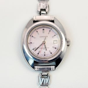 May include: A set of three ceramic mugs with a speckled, matte finish. Each mug features a different color: light blue, cream, and gray. The mugs have a simple, modern design and a comfortable handle.