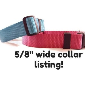May include: Two dog collars, one blue and one pink, both 5/8 inch wide.  The collars are made of nylon webbing and have plastic buckles.