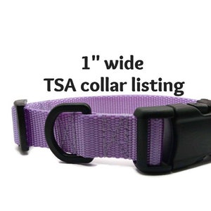 May include: A lavender dog collar, 1 inch wide, with a black plastic buckle and D-ring. The collar is made of woven material. Text on the image reads "1" wide TSA collar listing."