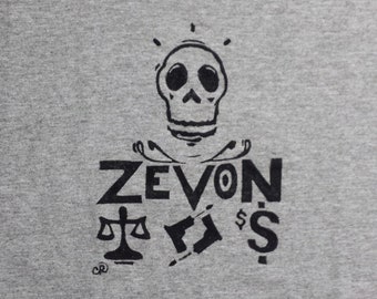 Nueva camisa estampada con bloques de Warren Zevon Lawyers Guns and Money, rock clásico, tinta negra sobre camisa unisex de algodón gris