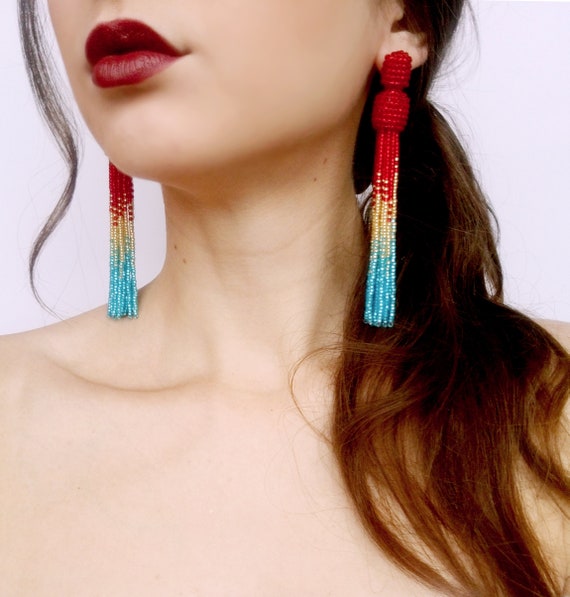 Earrings in style Oscar de la Renta Earrings embellished multi-colored tassel from raffia and with red and gold-tone beads Handmade.