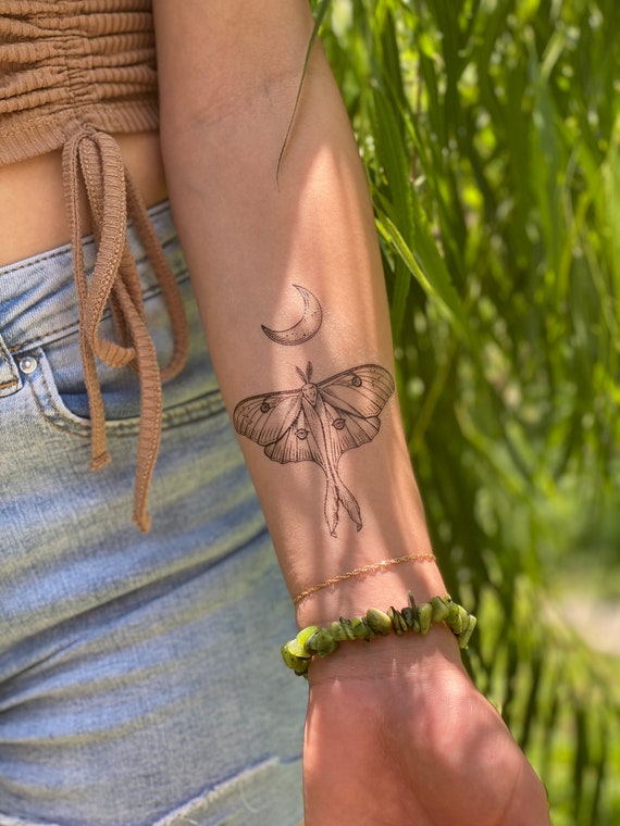 What are the different meanings of moth tattoos