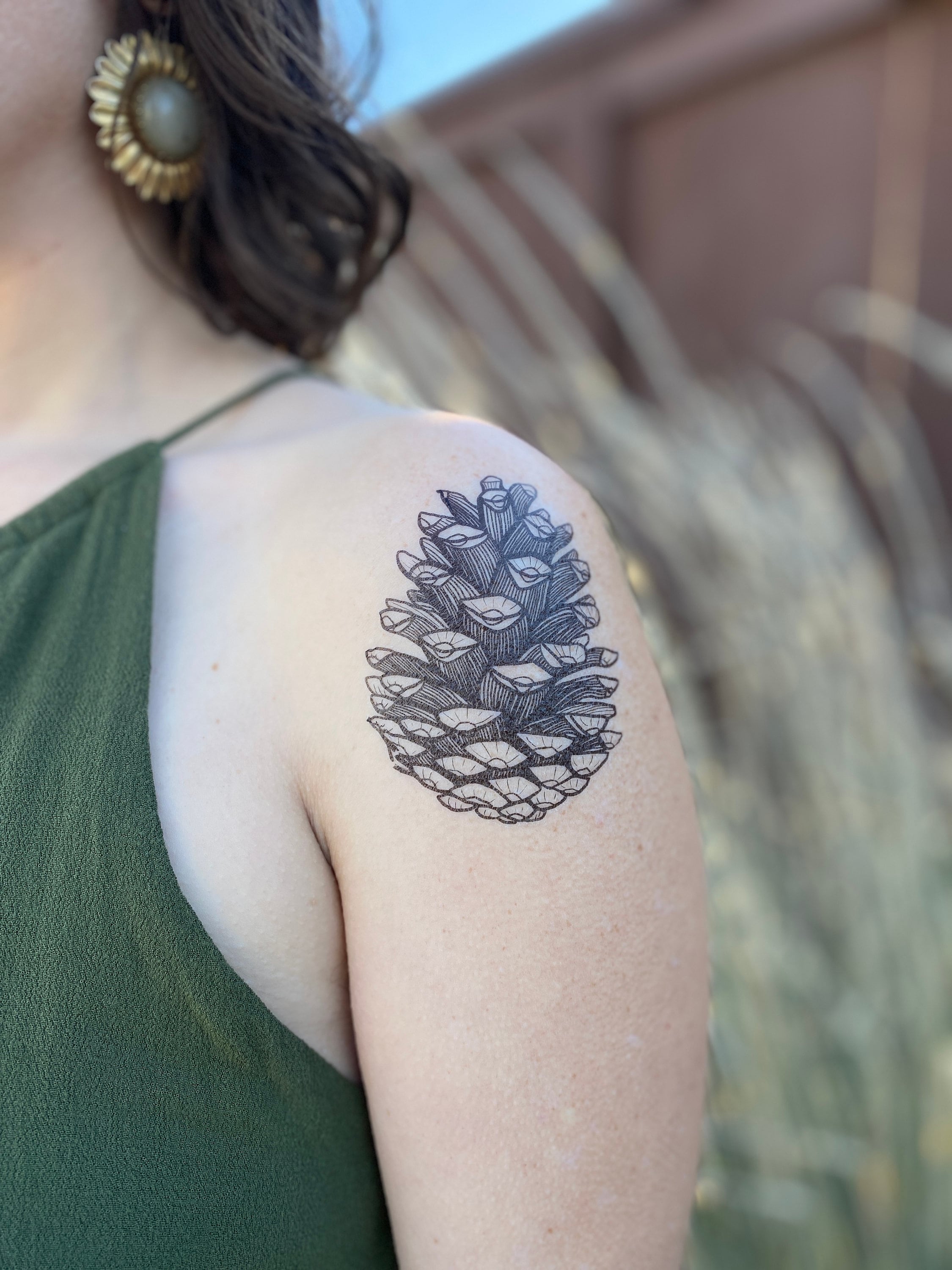 Simple Pine Cone Tattoo