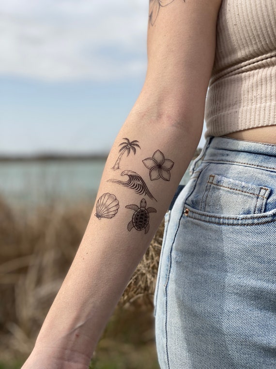 beach sun and wave tattoos on the foot | Small foot tattoos, Waves tattoo,  Tiny tattoos