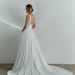 Elegant Minimalist A-Line Wedding Dress with Illusion Neckline, and Natural Waistline for a Stunning Bridal Look main image 1
