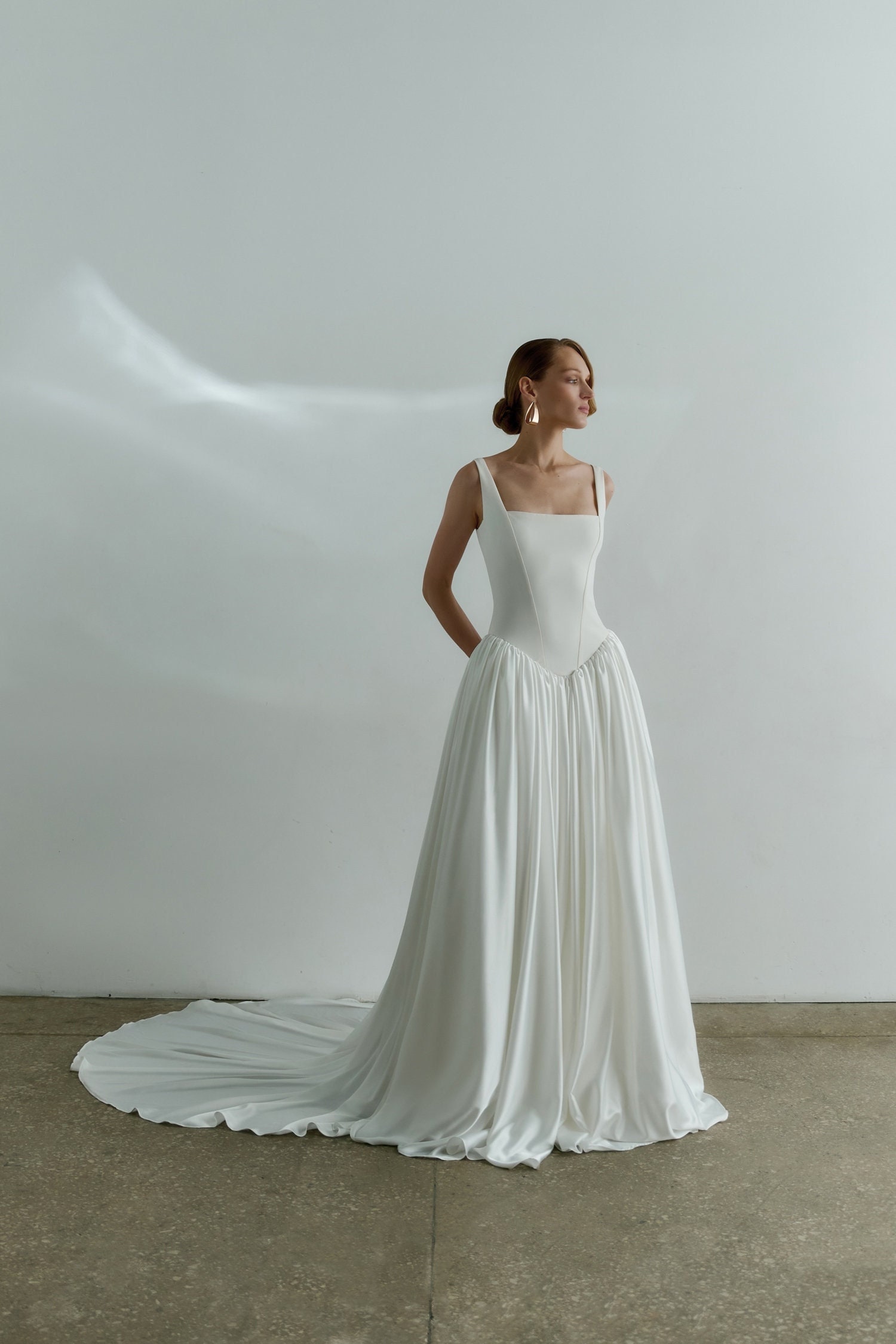 Exuding refined elegance, this drop waist pleated ballgown showcases a  skirt made of mikado scuba and a fitted corset bodice adorned with... |  Instagram