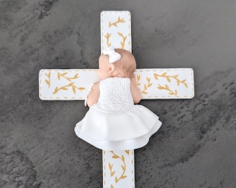 cross plate with miniature baby girl and christening garment