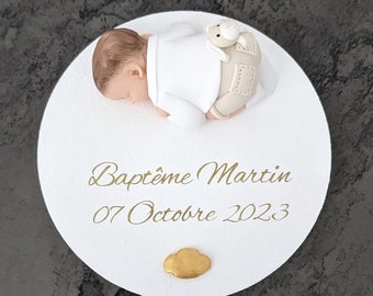 round plate with miniature baby boy and his cuddly toy