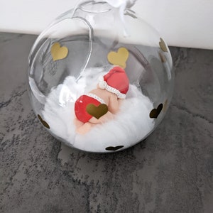 glass ball with baby diaper and miniature Christmas hat my first Christmas to personalize image 2