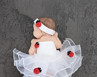 miniature baby girl figurine in tutu and her ladybugs for baptism birthday