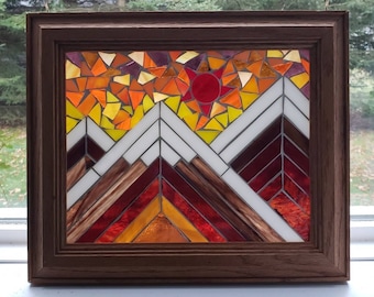 Wood look mosaic glass window created with stained glass set in a wood frame. Sunrise in mountain peaks. 12 1/2" x 10 1/2"