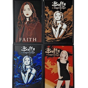 May include: Four framed art prints featuring characters from Buffy the Vampire Slayer. Each print has a black frame and depicts a different character with a knife. The top left print says "FAITH".