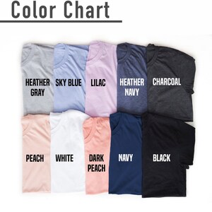 May include: Color chart showing 10 different t-shirt colors: Heather Gray, Sky Blue, Lilac, Heather Navy, Charcoal, Peach, White, Dark Peach, Navy, and Black.