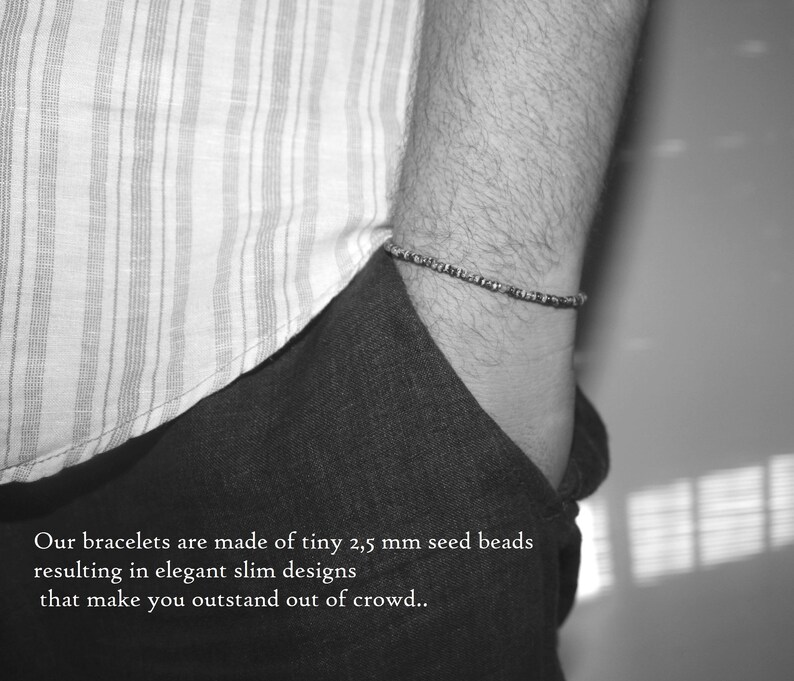 May include: A black and white photo of a person wearing a striped shirt and a bracelet made of tiny seed beads. The text "Our bracelets are made of tiny 2,5 mm seed beads resulting in elegant slim designs that make you outstand out of crowd.." is visible at the bottom of the image.