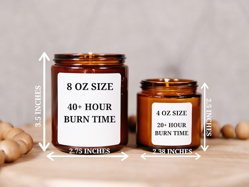 May include: Two amber glass candles with white labels. The larger candle is 3.5 inches tall and 2.75 inches wide, labeled "8 OZ SIZE" with "40+ HOUR BURN TIME." The smaller candle is 2.5 inches tall and 2.38 inches wide, labeled "4 OZ SIZE" with "20+ HOUR BURN TIME."