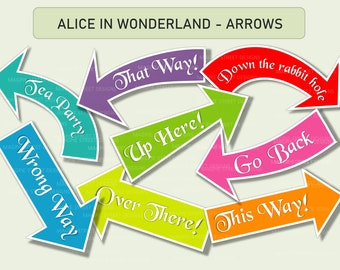 May include: A set of colorful arrow signs with whimsical text, such as "That Way!" and "Down the rabbit hole." These signs are perfect for a whimsical party or event.