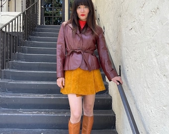 Chaqueta vintage de cuero de los años 70 con cinturón, peplum y forro sintético desmontable.