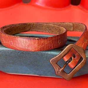 70s Embossed Thin Cognac Leather Belt with an Art Nouveau Buckle