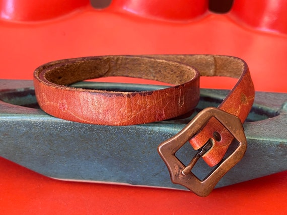 70s Embossed Thin Cognac Leather Belt with an Art… - image 1