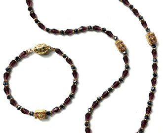 Italian purple torpedo beaded necklace and bracelet with gold accents from Dubai.