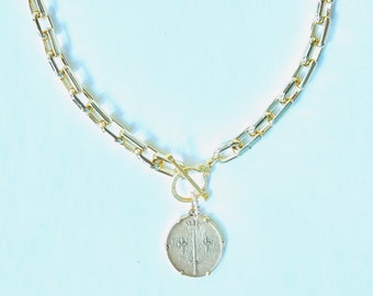 Gold rectangle necklace with reversible medallion. Toggle clasp.