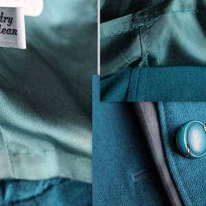 May include: Teal blue blazer with a single button closure and a satin lining. The label says "dry clean".