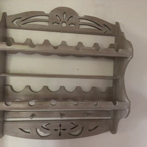 Bottle with solid wood hangers painted and waxed.