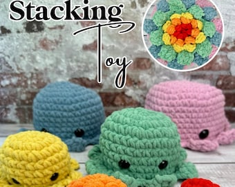 May include: A set of crocheted octopus stacking toys in various colors, including yellow, orange, green, blue, and pink. The toys are arranged on a white wooden surface. The text "Stacking Toy" is written in black at the top of the image. The text "Alter Ego Crochet" is written in black at the bottom of the image.